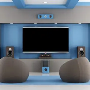 A room with two large chairs and a television.